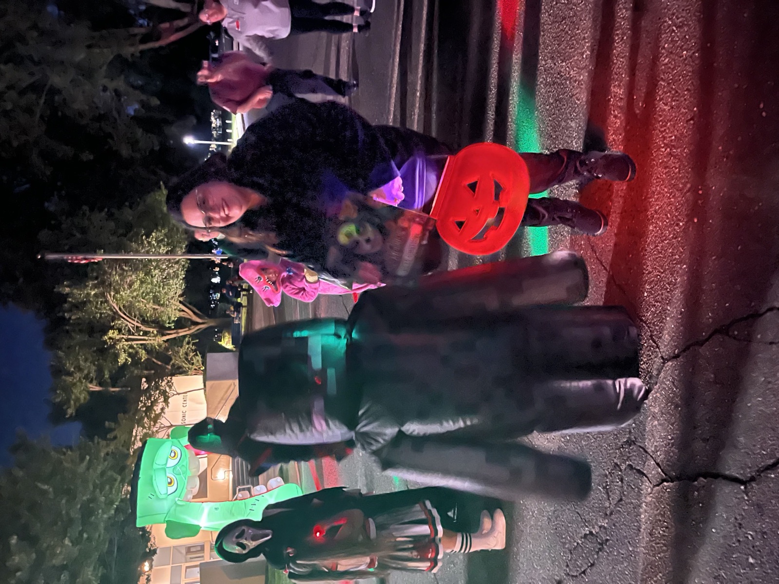 Halloween inflatables lit up at night